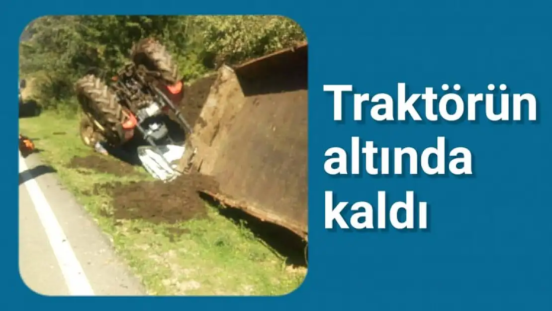 Devrilen traktörün altında kaldı