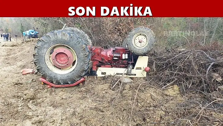 Devrilen traktörün altında kaldı